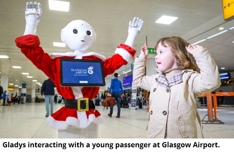 Gladys interacting with a young passenger at Glasgow Airport